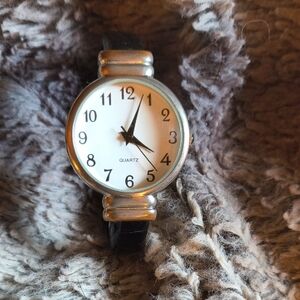 Elegant Silver and Black Cuff Watch with Vintage Charm